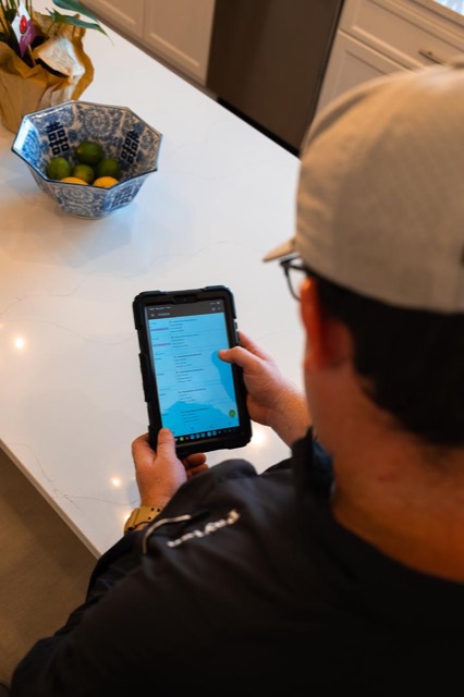 Clark technician preparing a flat-rate quote on a tablet