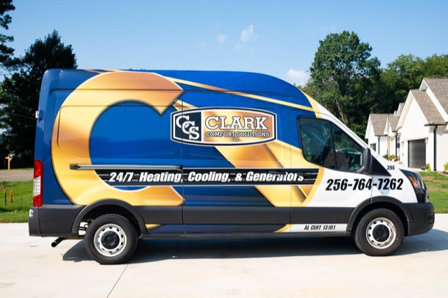Clark Comfort Solutions wrapped service van parked in a Florence neighborhood